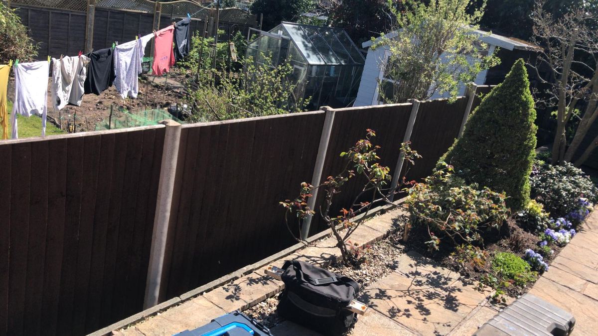 Dark brown fence with a trellis-topped panel in Stourbridge, photo 2