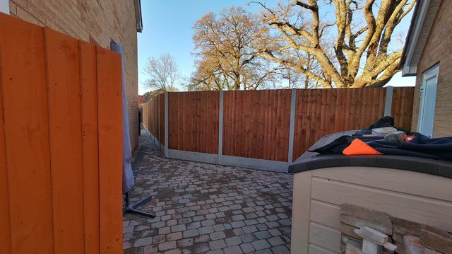 Closeboard fence beside a block-paved drive in Stourport-on-Severn